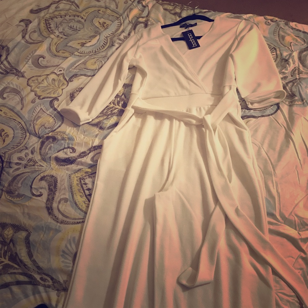 All white- brand new jumpsuit. semi flared bottom.